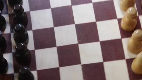 Rotating chessboard with chess pieces on a dark background. The rotating concept Stock-Footage 74355814