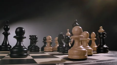Rotating chessboard with combination of white and black wooden chess figures Stock Footage 166844251