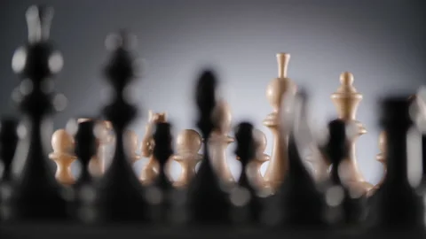 Rotating chessboard with lines of white and black wooden chess figures Stock Footage 166846648