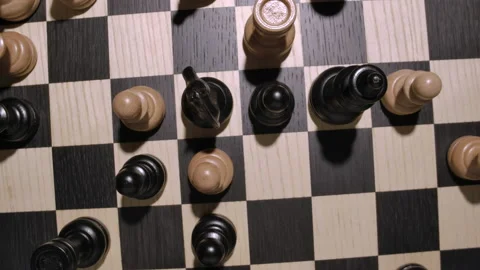 Rotating chessboard with white and black wooden chess figures top view Stock Footage 166842586