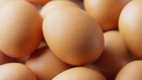 Rotating chicken eggs. Uncooked brown eggs. Close-up of hen eggs. Pile of eggs 스톡 동영상 303209642