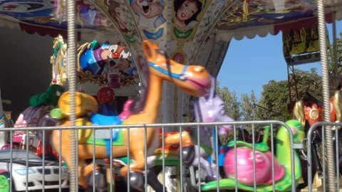 Rotating children's carousel in 4K Stock Footage 138617629