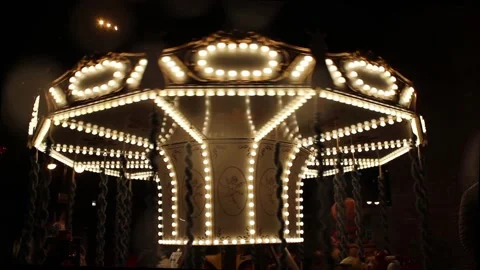 Rotating Children's carousel at night Video Stock Footage 225074286