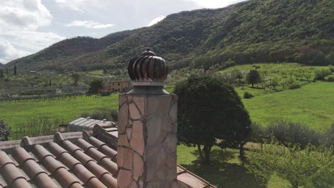 Rotating chimney ventilation on beautifully decorated private house against Stock Footage 318823635