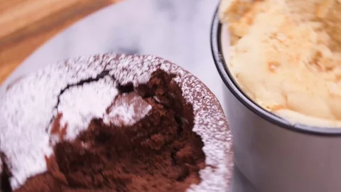 Rotating Chocolate Cake in a Mug With Vanilla Cake on Marble Over Wood Video stock 128162771
