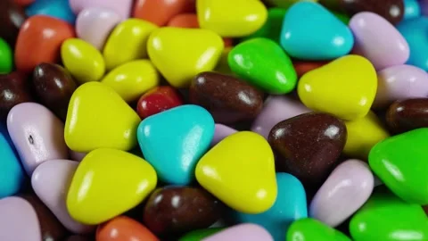 Rotating Chocolate Candies In The Shape Of Colored Hearts. Stock Footage 235521059