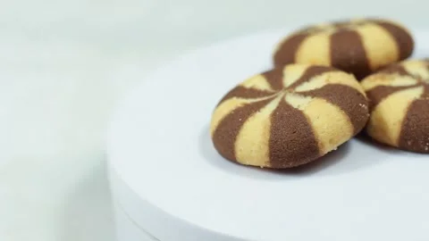 Rotating Chocolate-Flavored Round Biscuits on Display Video stock 280136677