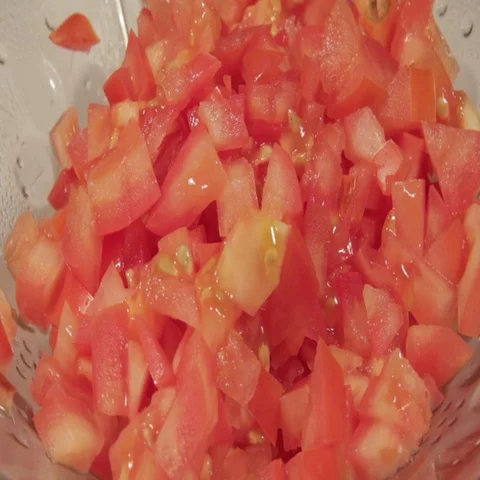 Rotating chopped tomatoes Stock Footage 69438904