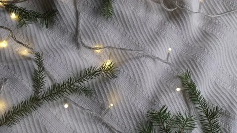 Rotating christmas background with white plaid branches of a christmas tree and Stock Footage 167369081
