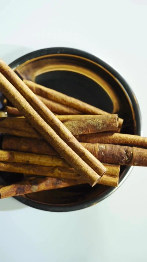 Rotating Cinnamon Displayed On Clean White Studio Background Video stock 331763614