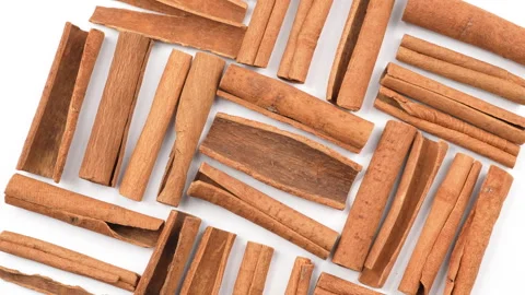 Rotating Cinnamon Sticks On White Background Flat Lay Vídeo Stock 331380406