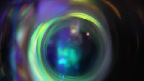 Rotating circles reflect rainbow sparkles and lights. Abstract holiday Video stock 317129684