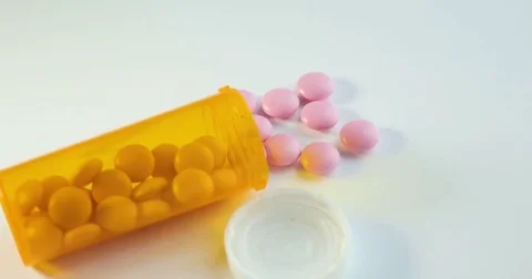 Rotating circular drug. Pill bottle spilling medical pills. Prescription Bottle Video stock 78532015