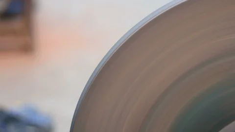 Rotating circular sanding machine used as knife sharpener Stock Footage 119210420