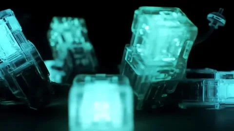 Rotating Clear Plastic Shapes with Cyan Lighting Macro Shot Stock Footage 313324291