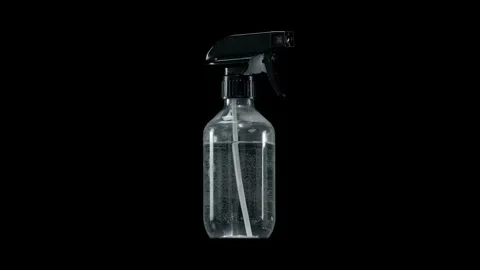 Rotating Clear Spray Bottle Isolated on Black Background Stock Footage 328485996