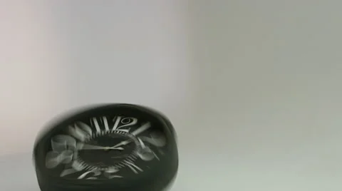 Rotating clock hits the floor.  Stock Footage 59719366