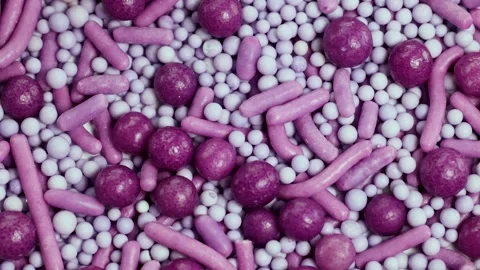 Rotating Close-Up of Colorful Cake Sprinkles Stock Footage 306909596