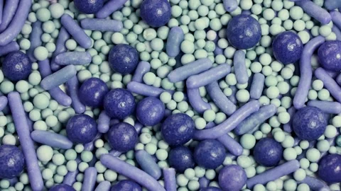 Rotating Close-Up of Colorful Cake Sprinkles Stock Footage 308501506
