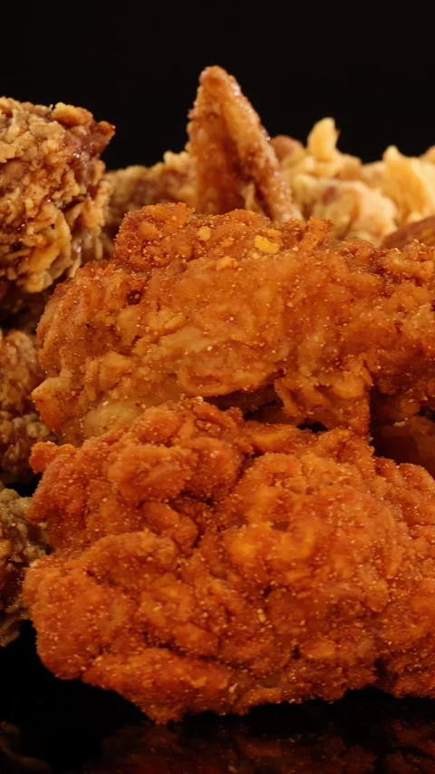 Rotating Close-Up of Crispy Fried Chicken and Nuggets Stock Footage 313248426