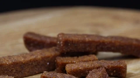 Rotating close-up of crispy rye croutons in garlic sauce on display. Stock Footage 299094295
