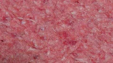 Rotating close up of hamburger raw minced meat Stock Footage 141220611