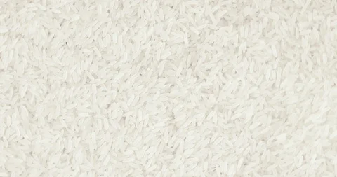 Rotating close up of a pile of raw rice Stock Footage 95575508