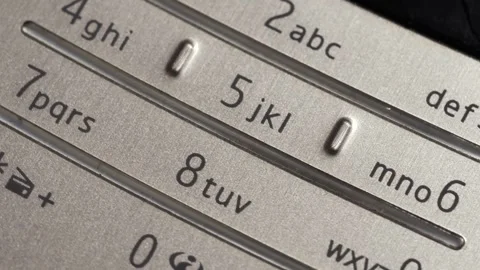 Rotating Close Up Of Silver Mobile Phone Keypad Stockbeeldmateriaal 332645934