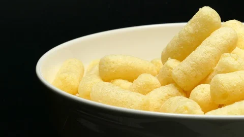 Rotating Close Up Of Sweet Corn Sticks On A White Bowl On A Black Background. Stock Footage 128710784