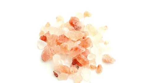 Rotating closeup of Himalayan Salt isolated on white Stock Footage 75521936