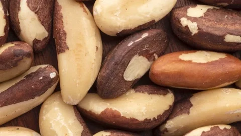 Rotating closeup top view of brazil nuts. Food backdrop Stock Footage 201019594