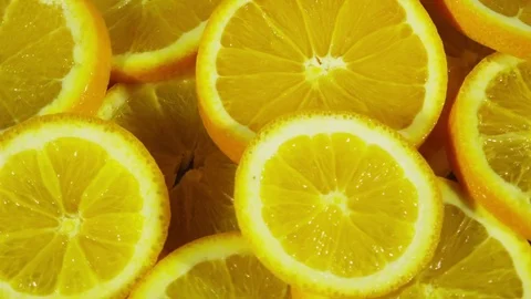 Rotating closeup view of sliced oranges Stock Footage 80132305
