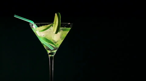 Rotating cocktail with  lime and ice Stockbeeldmateriaal 23977870