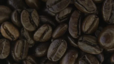 Rotating Coffee Beans With Atmospheric Smoke Macro. 스톡 동영상 334575895