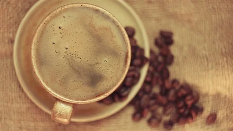Rotating the coffee in the cup Stock Footage 80032196