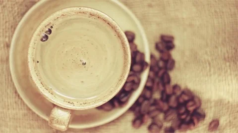 Rotating the coffee in the cup Stock Footage 80032233