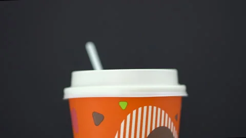 Rotating the coffee paper cup 4K Video stock 154514696