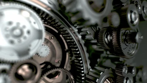 Rotating cogs of different materials and sizes interlock precisely. A metap.. Stock Footage 303499346