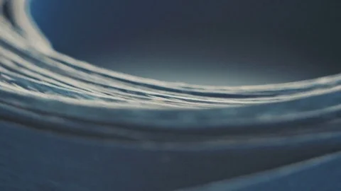 Rotating coil of paper Stock Footage 80899648