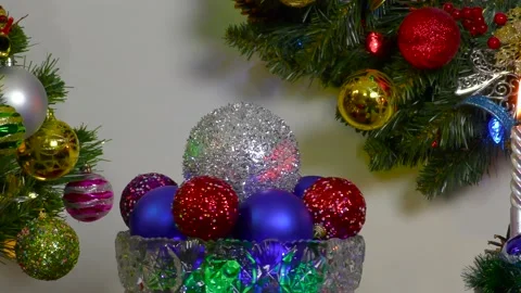 Rotating colored balls in a vase on the background of a christmas composition Stock Footage 201674518