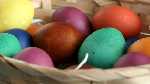 Rotating Of Colorful Easter Eggs Lying On Straw In A Basket. Natural Daylight. C 스톡 동영상 126590333