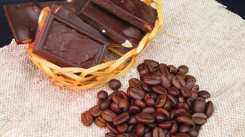 Rotating composition with chocolate and coffee beans Video stock 116430300