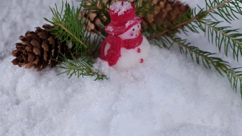 Rotating composition with a snowman with cones and branches of a Christmas tree Stock Footage 167675819