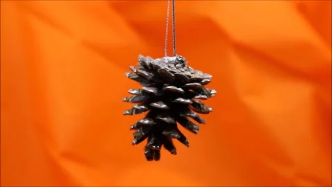 Rotating cone on orange background. Christmas concept Video stock 167635169