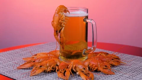 Rotating crayfish on a gray napkin over red background. Stock Footage 122924221
