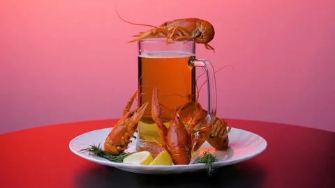 Rotating crayfish on a white dish with lemon and green stuff Stock Footage 125262468