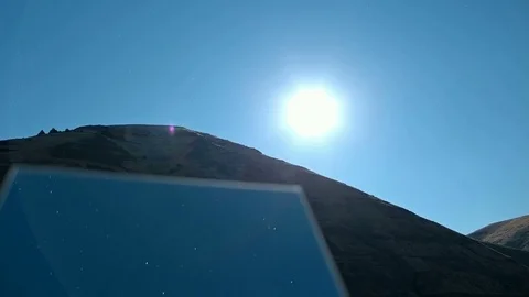 Rotating creative mirror in the desert at night blue moonlit sky time lapse Stock-Footage 81798752