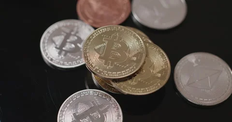 Rotating Crypto coins on dark surface. Gold and Silver BTC coins Stock Footage 172054067