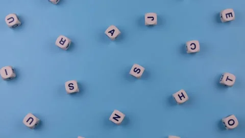 Rotating cubes or blocks word with letters randomly on a blue background - the Stock Footage 194764188