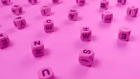 Rotating cubes or blocks word with letters randomly on a pink background Stock Footage 228666807